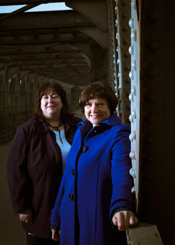 Samantha Robb-McKinlay, left, and Linda Griffin photographed smiling and looking directly at the camera 